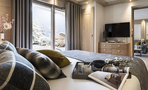 chambre d'un appartement type résidence pied des pistes grand-bornand chinaillon location ski montagne